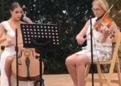 Susan Curran with her daughter Olivia Culpo playing music in Malibu.